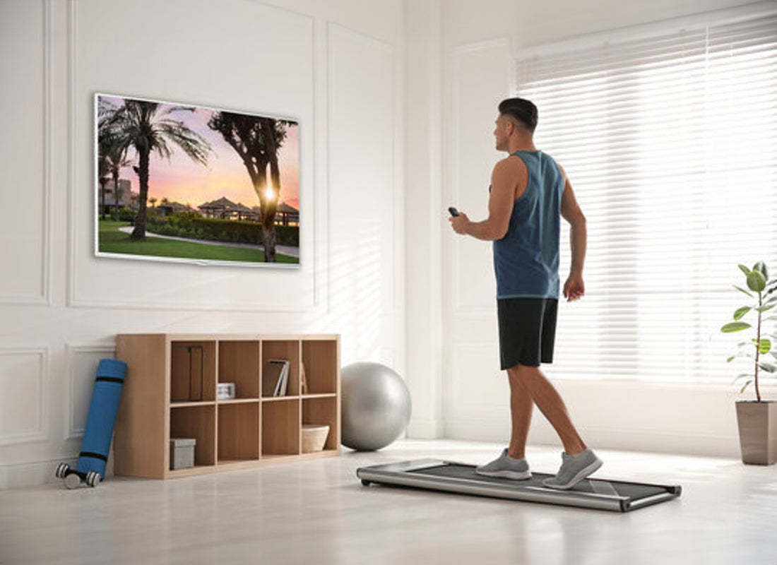 Men walking on a walking pad at home